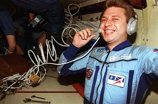 Onufriyenko grins as he listens on a headset.